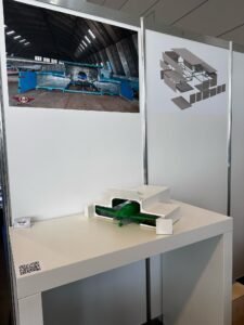 Scale model of Micro Hangar modular aircraft storage system displayed at AERO 2025