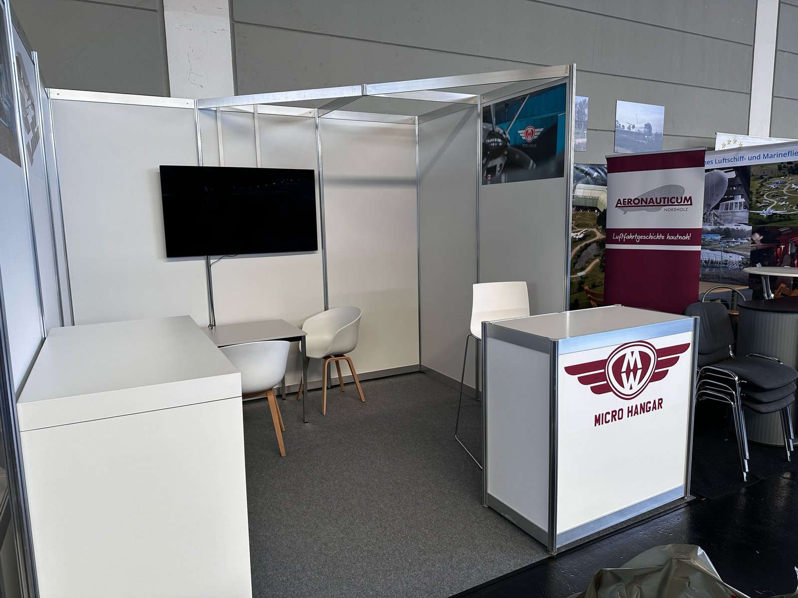 Micro Hangar exhibition booth at AERO 2025 in Friedrichshafen showcasing compact aircraft storage technology